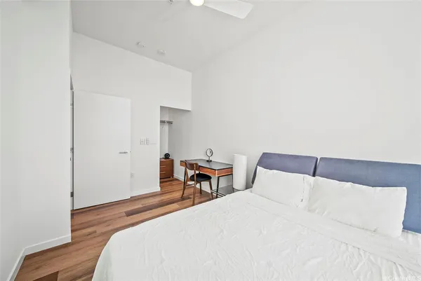 a bedroom with a bed and a table