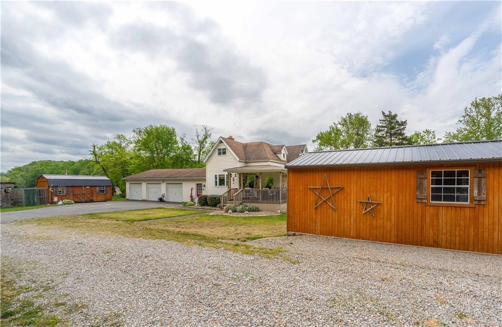 645 New Geneva Road Point Marion, PA 15474 - Photo 24 of 36 a view of a house with backyard and roof