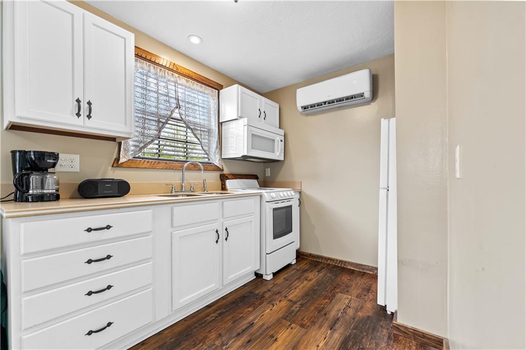 645 New Geneva Road Point Marion, PA 15474 - Photo 29 of 36 a kitchen with sink cabinets and window