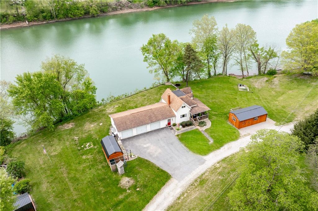 645 New Geneva Road Point Marion, PA 15474 - Photo 4 of 36 an aerial view of a house with swimming pool and lake view