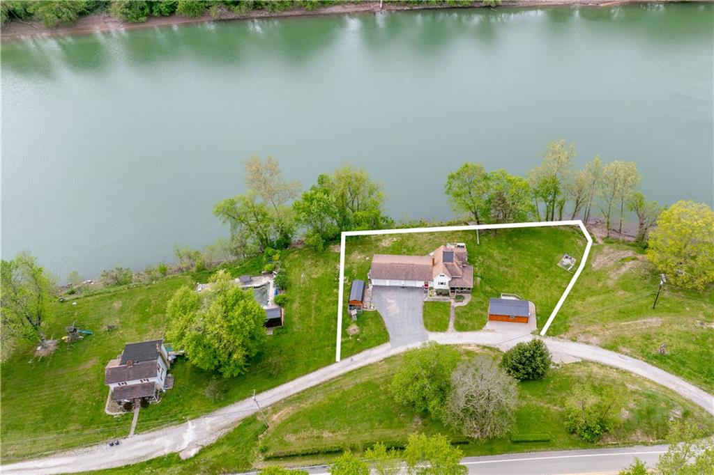 645 New Geneva Road Point Marion, PA 15474 - Photo 5 of 36 an aerial view of a house with a yard and lake view