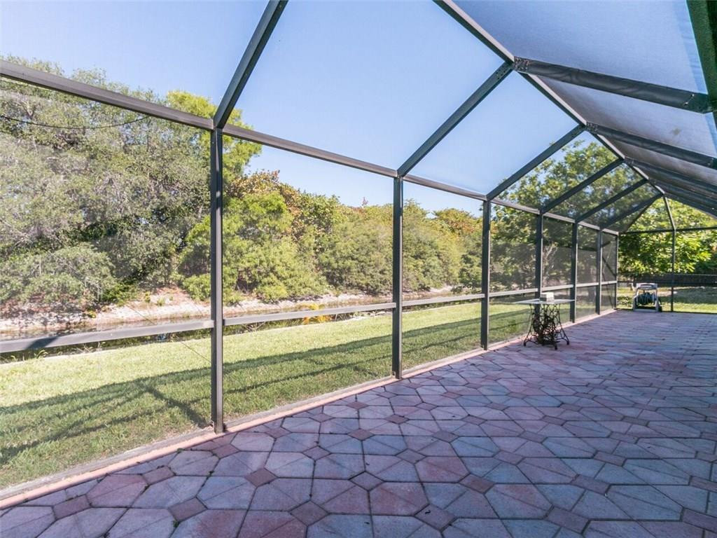 7517 Texas Trail Boca Raton, FL 33487 - Photo 7 of 32 Screened in patio overlooking the canal