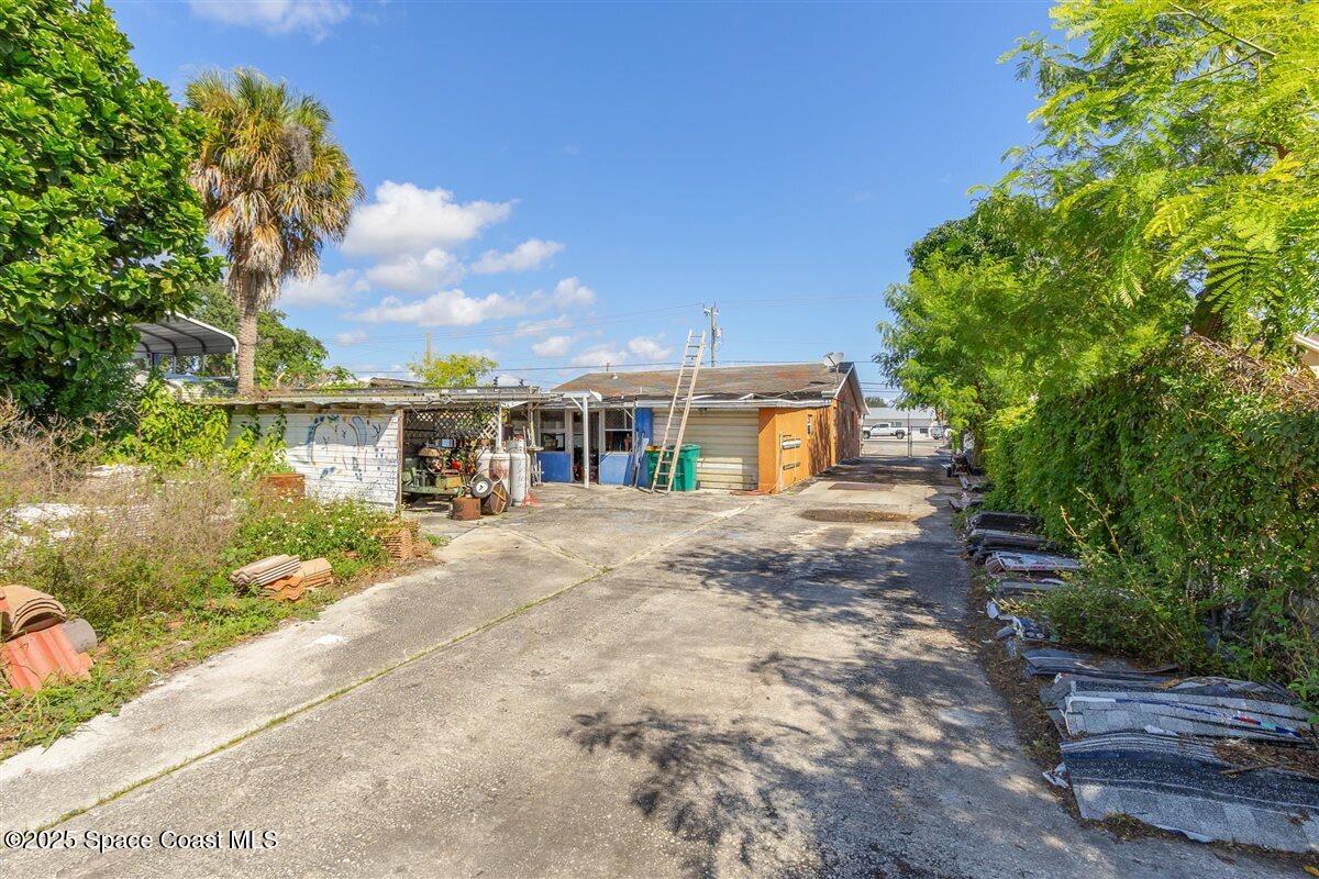 2015 Aurora Road Melbourne, FL 32935 - Photo 20 of 27 a front view of house with yard and green space