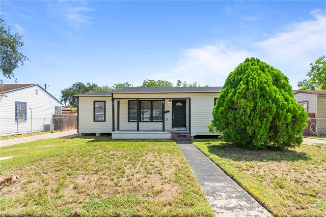 a view of a house with a garden