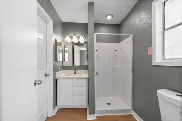 a bathroom with a double vanity sink and mirror