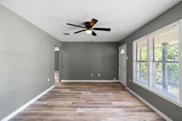 a view of an empty room with a window