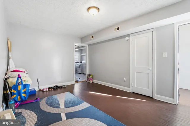 a hallway with furniture and rug