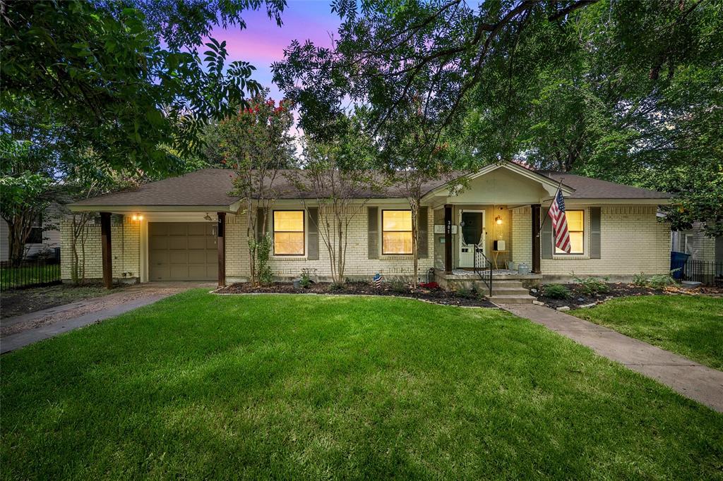 301 North 40th Street Waco, TX 76710 - Photo 1 of 26 Exterior features a light-colored brick facade, a covered front entry with steps, and a single-car garage