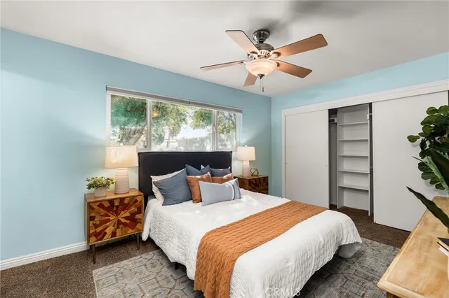 a bedroom with a bed and window