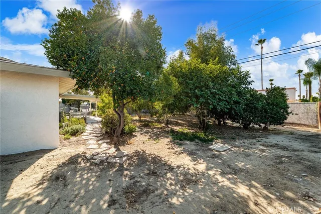 a view of a yard with table and chairs