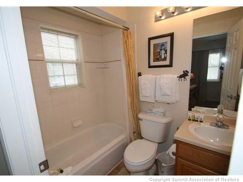487 Main Street, Unit A Frisco, CO 80443 - Photo 16 of 22 a bathroom with a sink toilet and shower