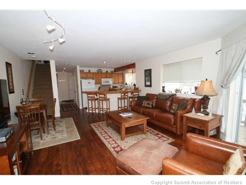 487 Main Street, Unit A Frisco, CO 80443 - Photo 22 of 22 a living room with furniture kitchen view and a large window