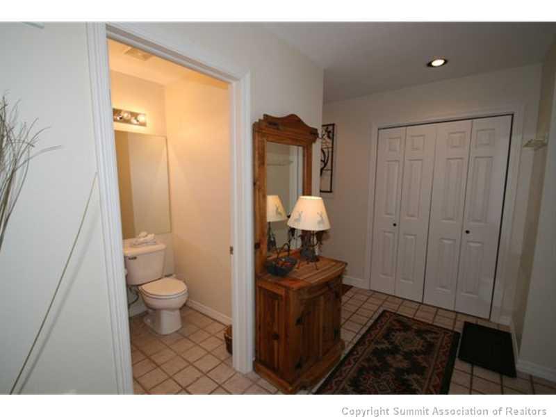 487 Main Street, Unit A Frisco, CO 80443 - Photo 8 of 22 a bathroom with a sink a toilet and a mirror