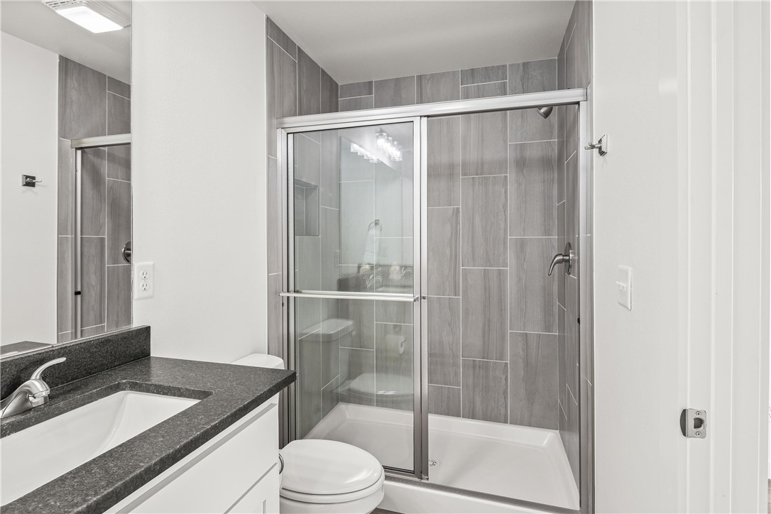 547 West Pickens Road Pea Ridge, AR 72751 - Photo 15 of 17 Bathroom with vanity and a shower stall