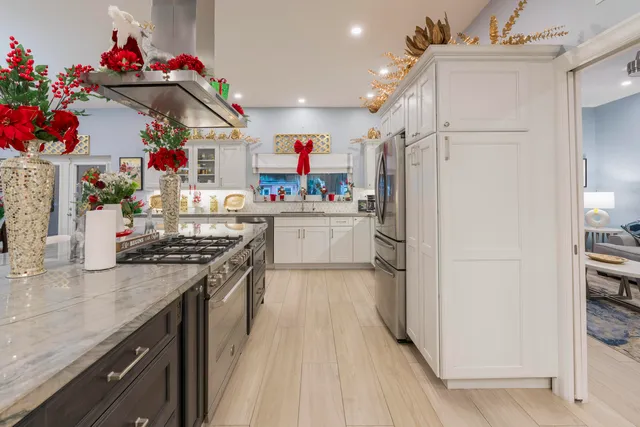 a bathroom with a granite countertop sink mirror vanity and toilet