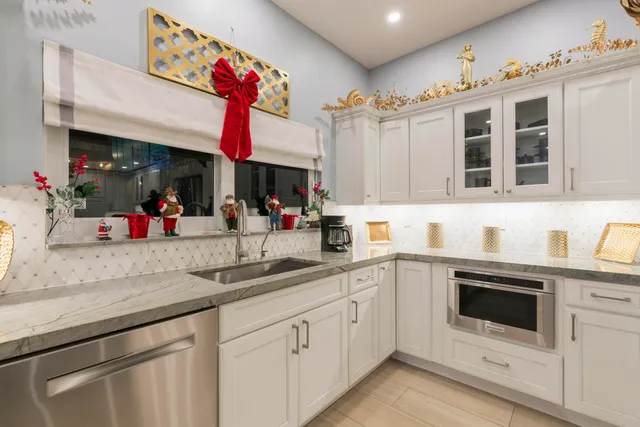 a view of a patio with dining table and chairs with wooden floor