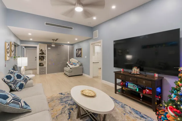 an aerial view of a house with a yard and a bench