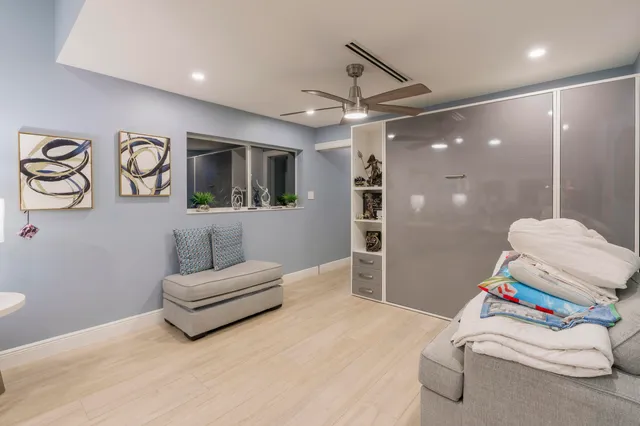 an aerial view of a house with garden space and sitting area