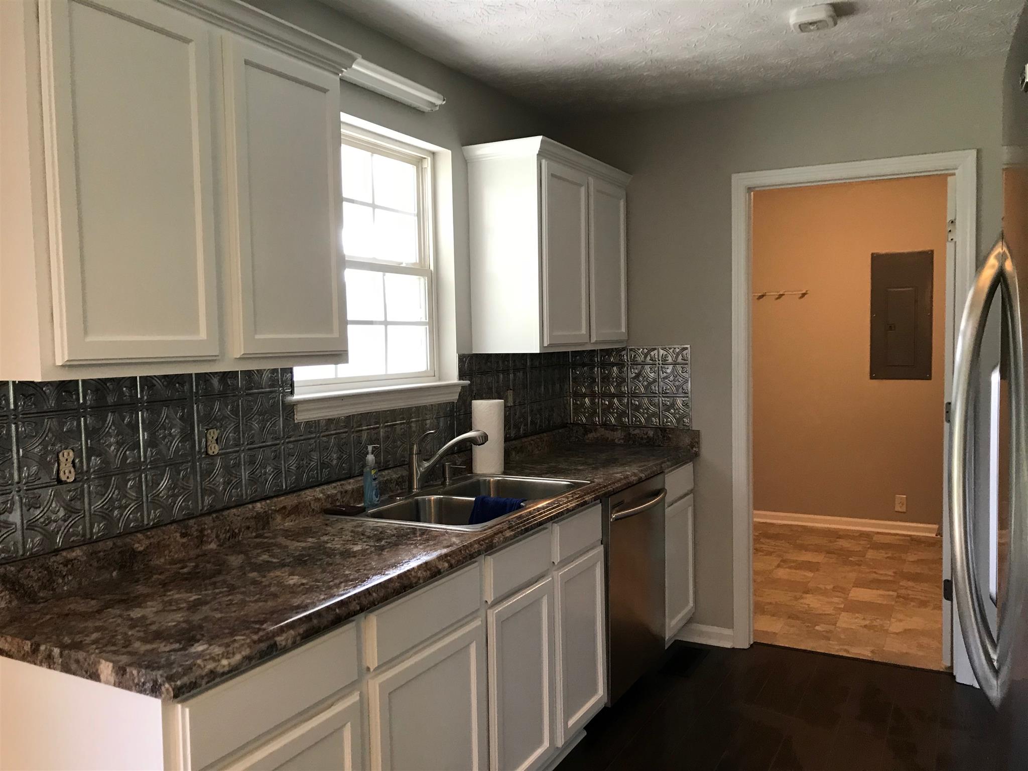 604 Tidwell Road Bon Aqua, TN 37025 - Photo 5 of 20 Nice kitchen with stainless appliances and tin backsplash