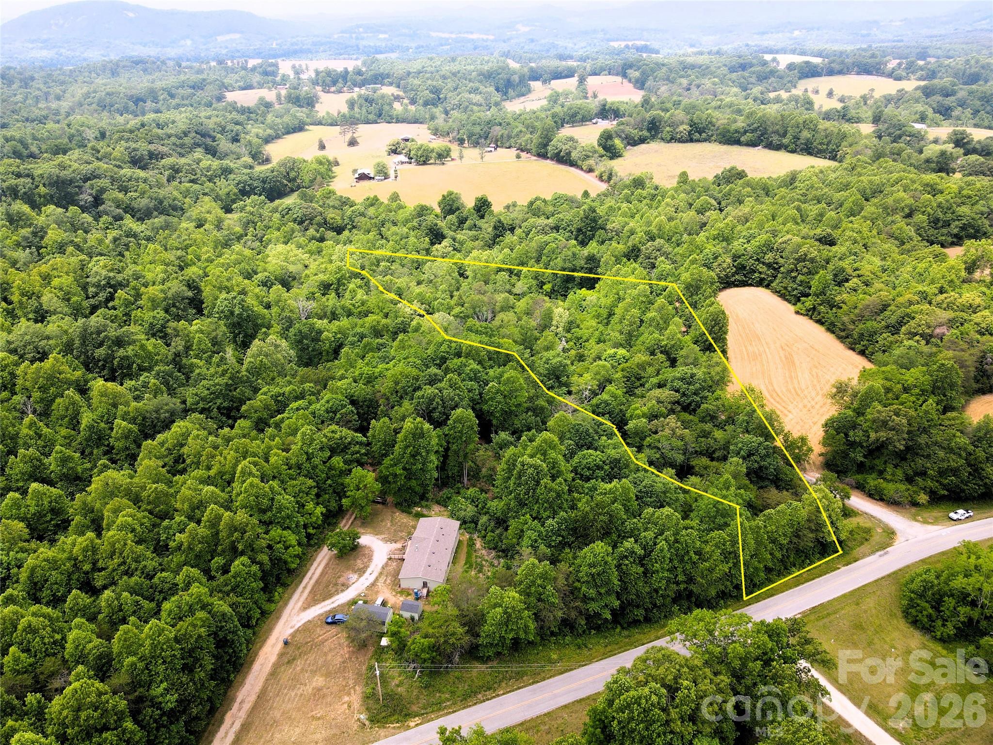 6 Hopewell Church Road, Unit 6 Hiddenite, NC 28636 - Photo 2 of 33 an aerial view of a house with a yard and lake view