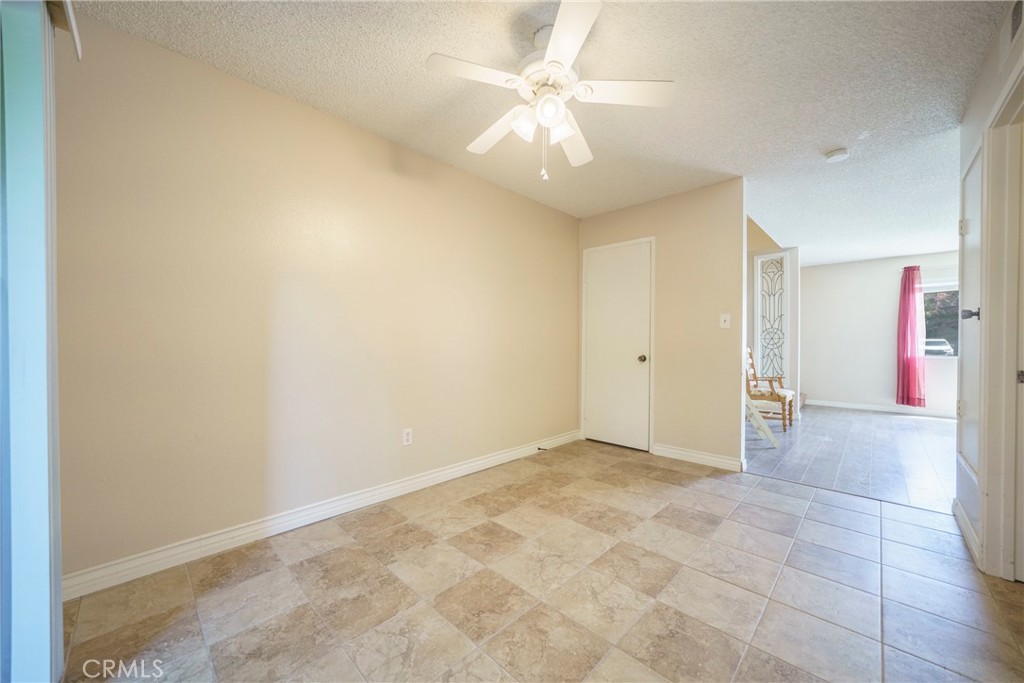 2255 Cahuilla Street, Unit 32 Colton, CA 92324 - Photo 11 of 35 wooden floor in an empty room with a window