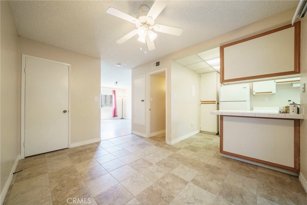 2255 Cahuilla Street, Unit 32 Colton, CA 92324 - Photo 13 of 35 a view of a kitchen with a sink and a refrigerator