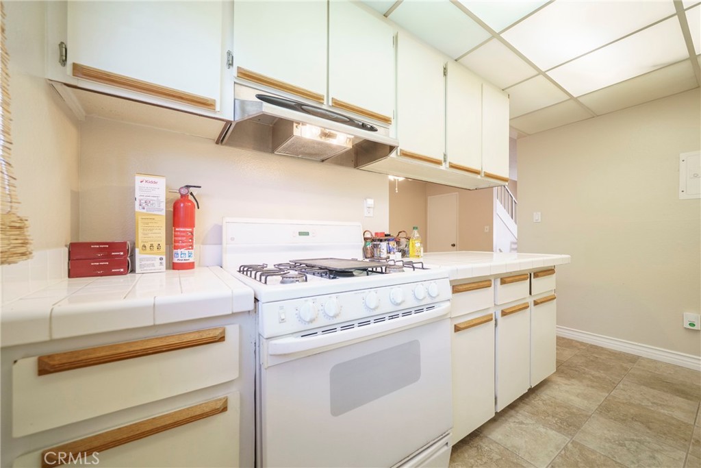 2255 Cahuilla Street, Unit 32 Colton, CA 92324 - Photo 16 of 35 a kitchen with cabinets and appliances