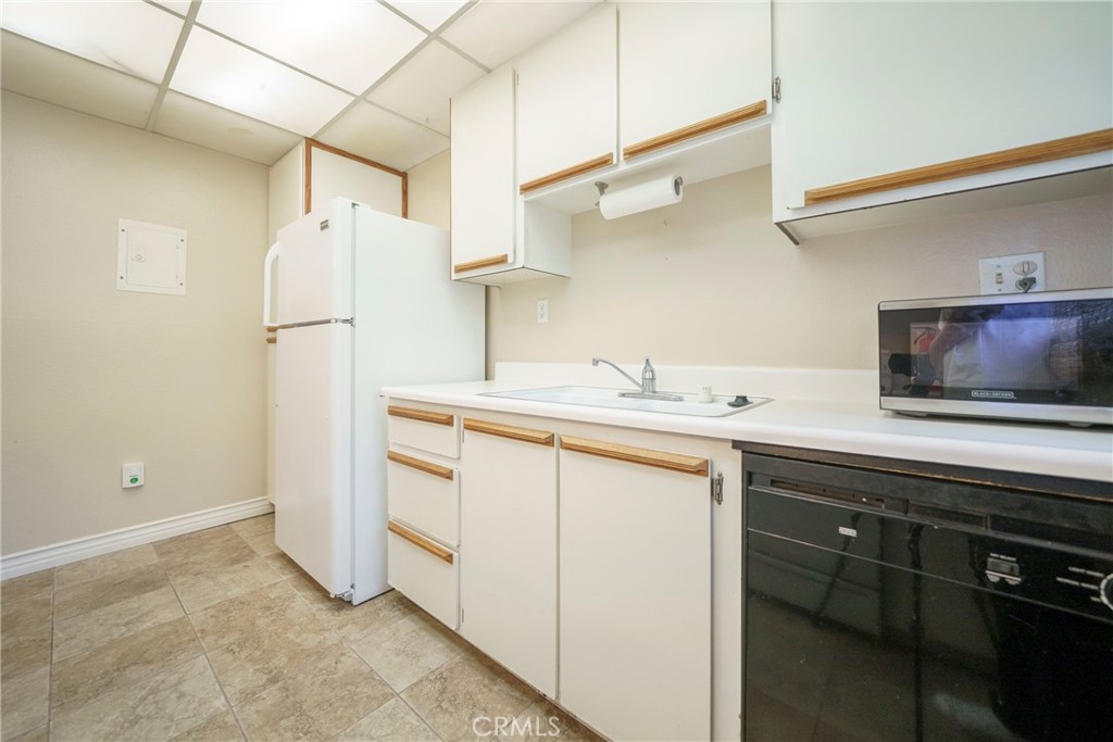 2255 Cahuilla Street, Unit 32 Colton, CA 92324 - Photo 17 of 35 a kitchen with a sink cabinets and appliances