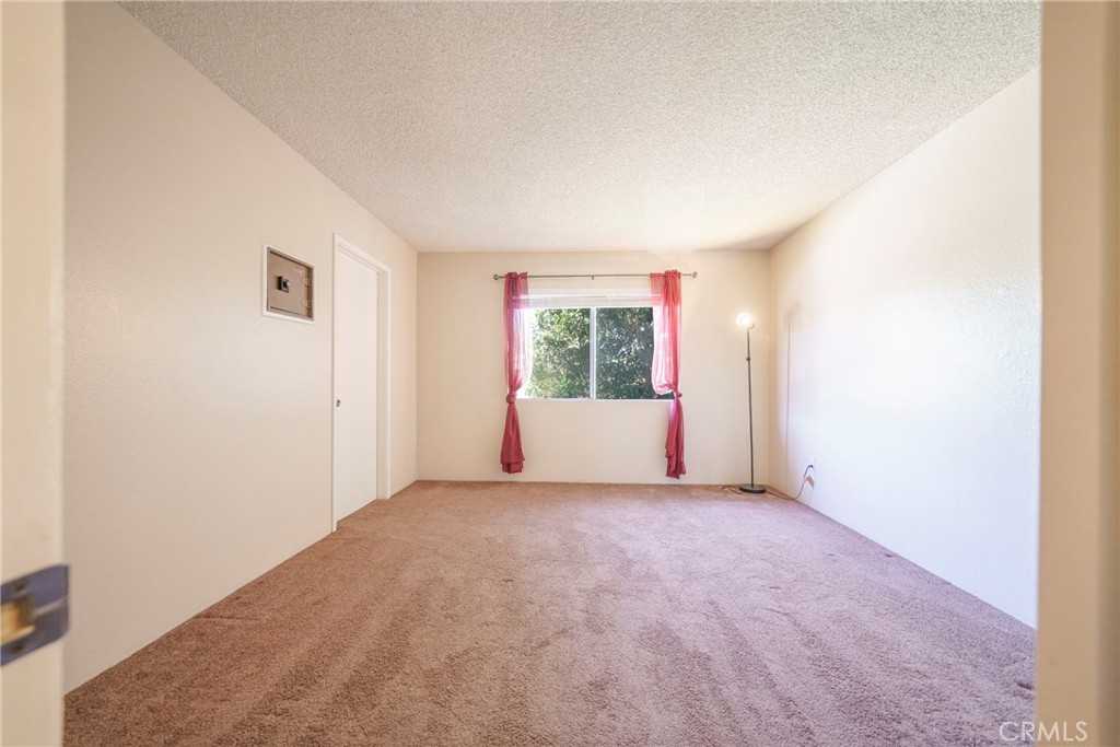 2255 Cahuilla Street, Unit 32 Colton, CA 92324 - Photo 21 of 35 an empty room with windows