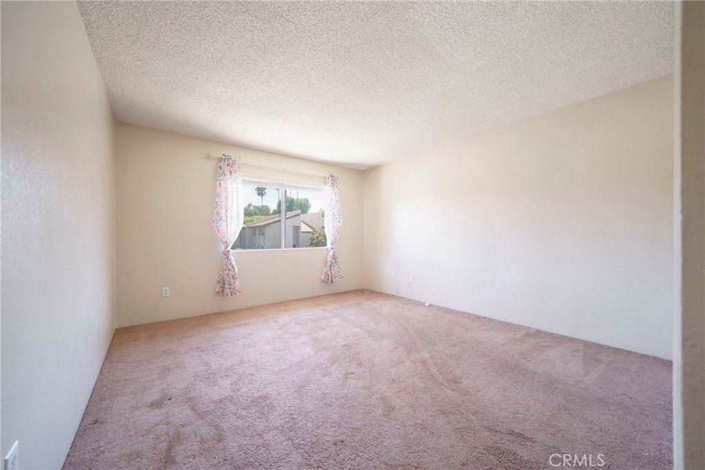 2255 Cahuilla Street, Unit 32 Colton, CA 92324 - Photo 22 of 35 an empty room with windows