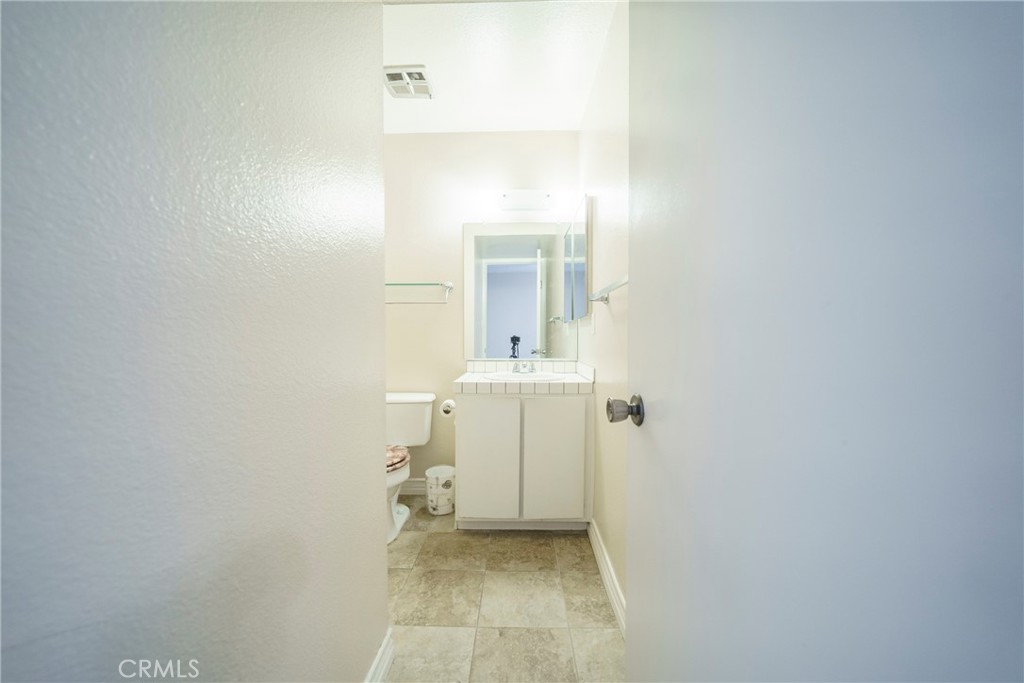 2255 Cahuilla Street, Unit 32 Colton, CA 92324 - Photo 23 of 35 a bathroom with a sink and mirror