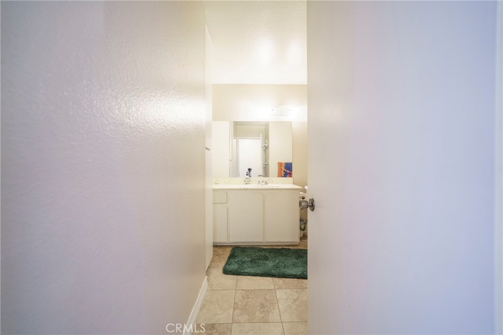 2255 Cahuilla Street, Unit 32 Colton, CA 92324 - Photo 25 of 35 a bathroom with a sink and a mirror