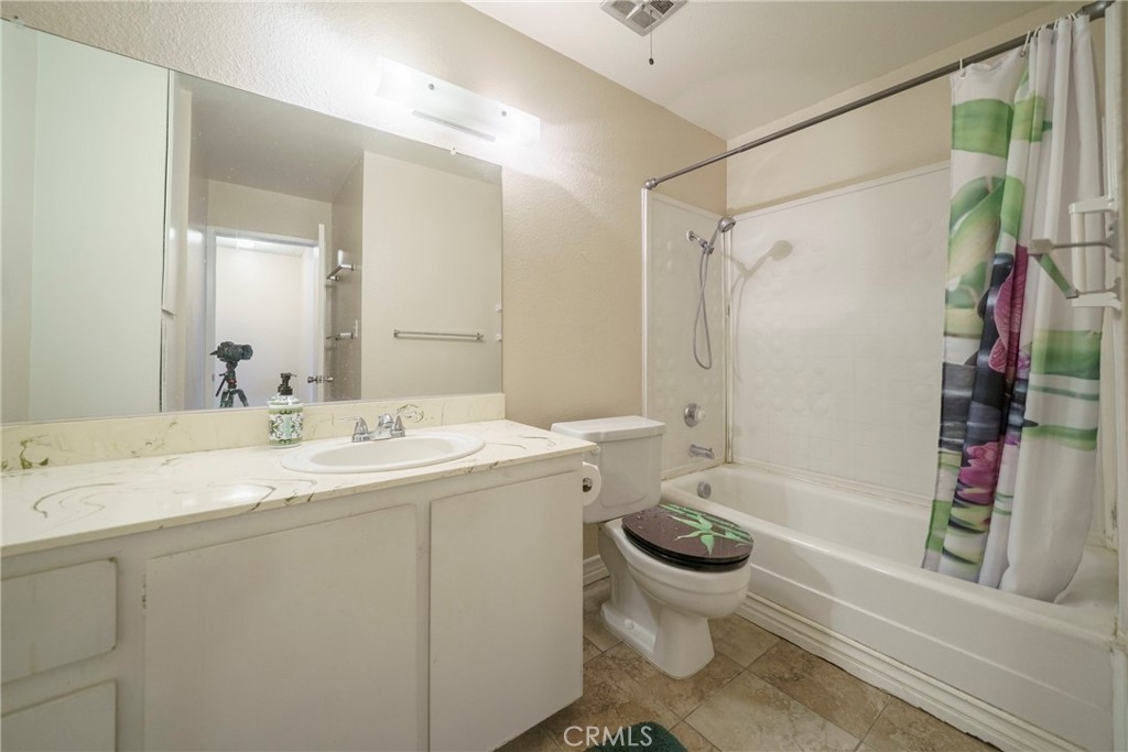 2255 Cahuilla Street, Unit 32 Colton, CA 92324 - Photo 26 of 35 a bathroom with a double vanity sink toilet and shower