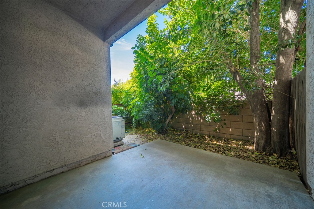 2255 Cahuilla Street, Unit 32 Colton, CA 92324 - Photo 27 of 35 a view of a house with a tree