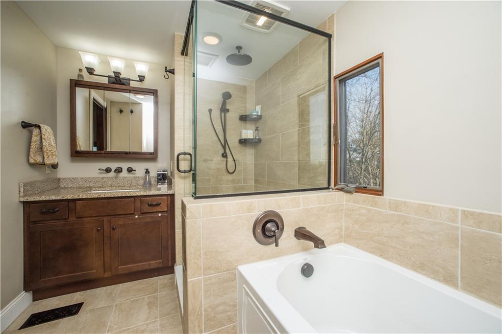 1030 Prospect Road Pittsburgh, PA 15227 - Photo 19 of 25 This view shows the soaking tub and glass shower, completed with rain head shower!