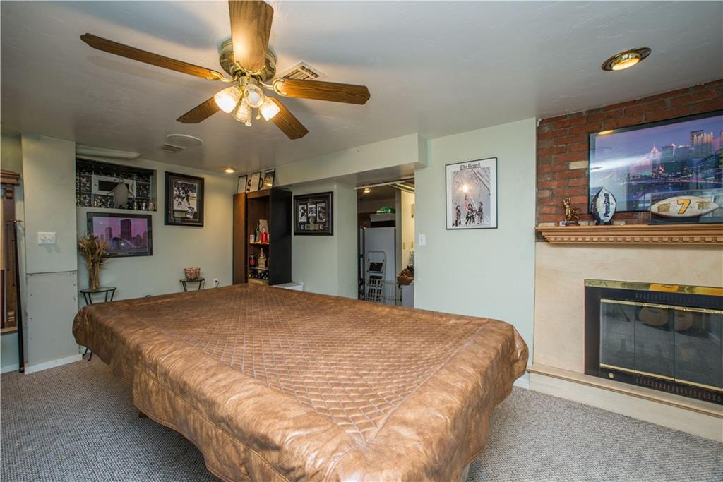 1030 Prospect Road Pittsburgh, PA 15227 - Photo 22 of 25 This view of the game room shows the fireplace.