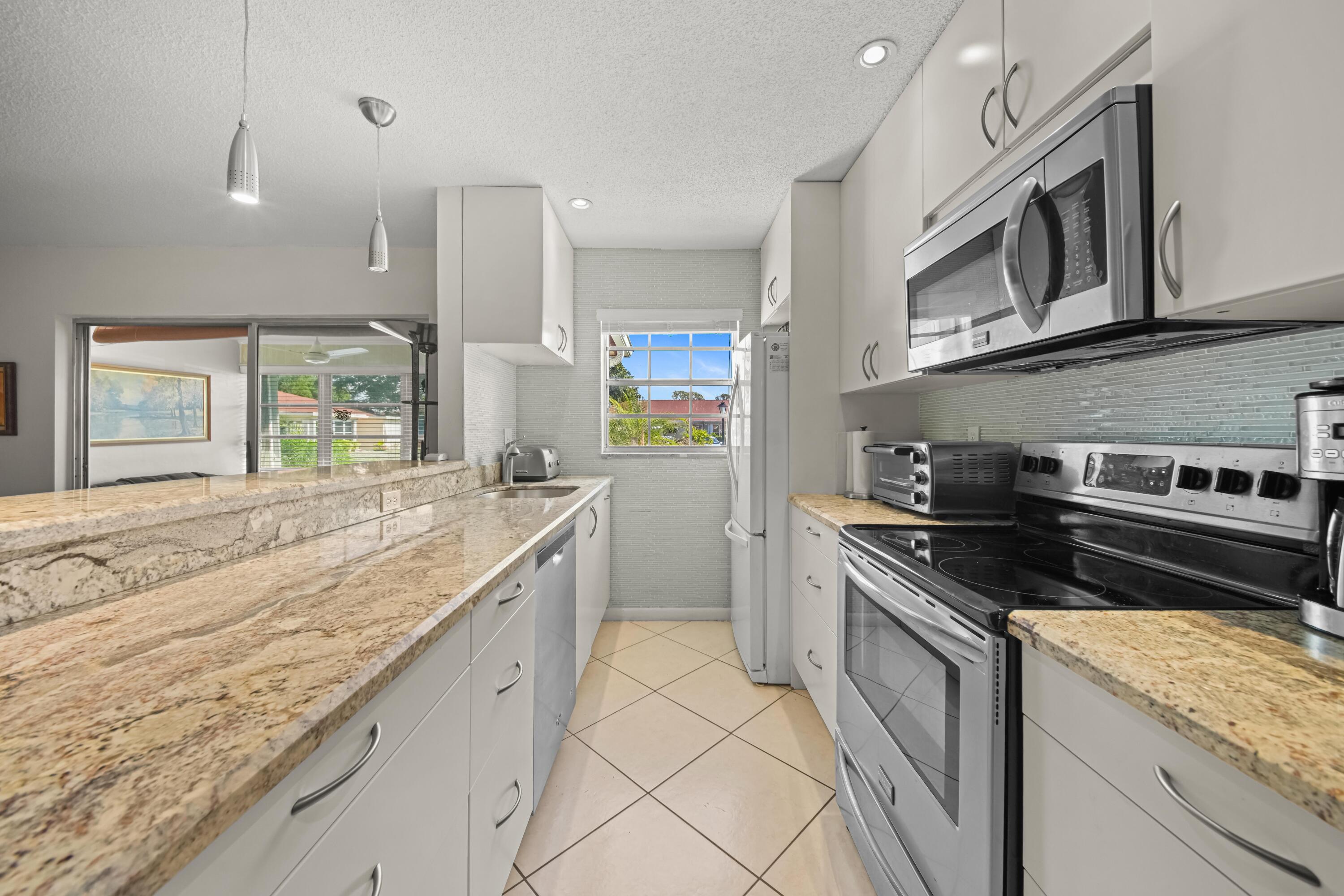 4875 Northwest 3rd Court, Unit C Delray Beach, FL 33445 - Photo 3 of 21 kitchen