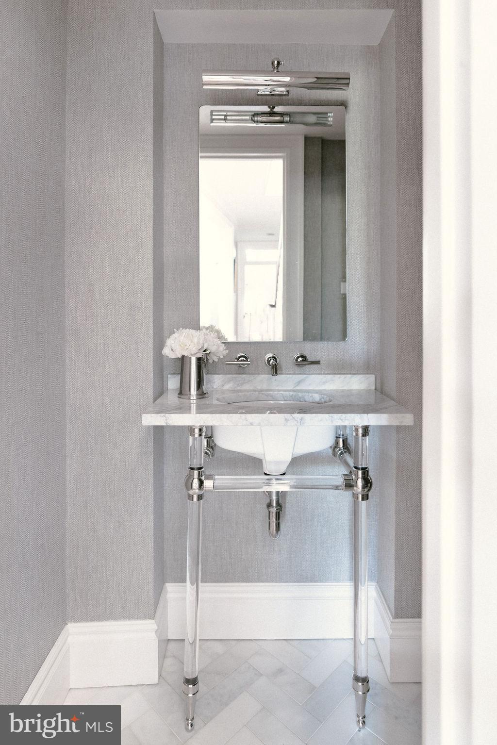 400 G Street Southeast Washington, DC 20003 - Photo 15 of 56 a bathroom with a sink and a mirror