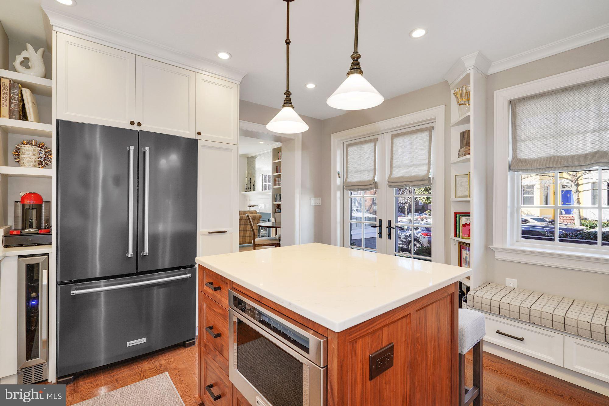 400 G Street Southeast Washington, DC 20003 - Photo 18 of 56 a kitchen with a refrigerator and a chandelier