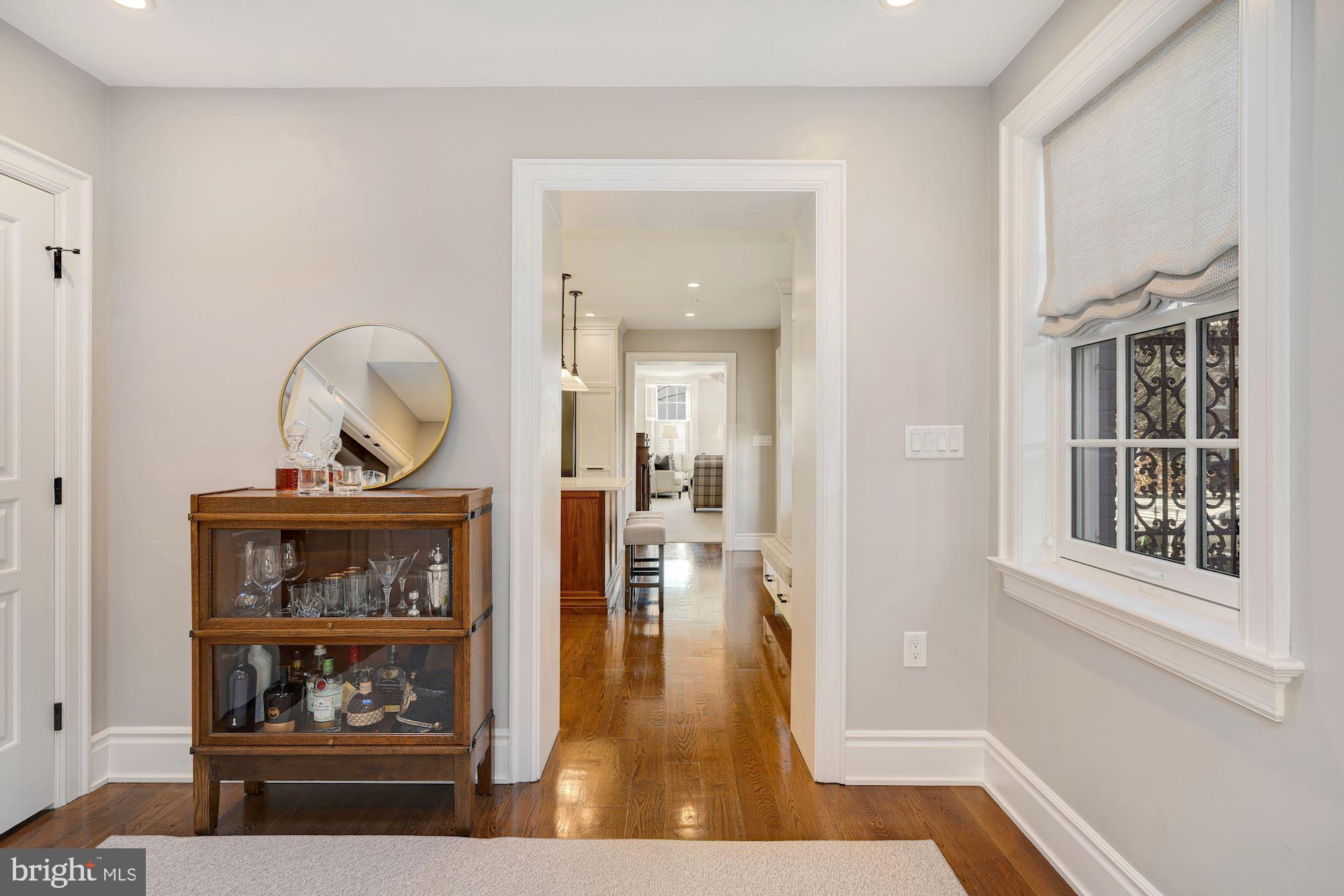 400 G Street Southeast Washington, DC 20003 - Photo 22 of 56 a view of a hallway to a livingroom with wooden floor and a rug