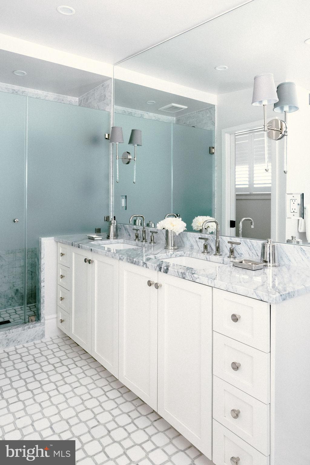 400 G Street Southeast Washington, DC 20003 - Photo 25 of 56 a bathroom with a sink a vanity and a mirror
