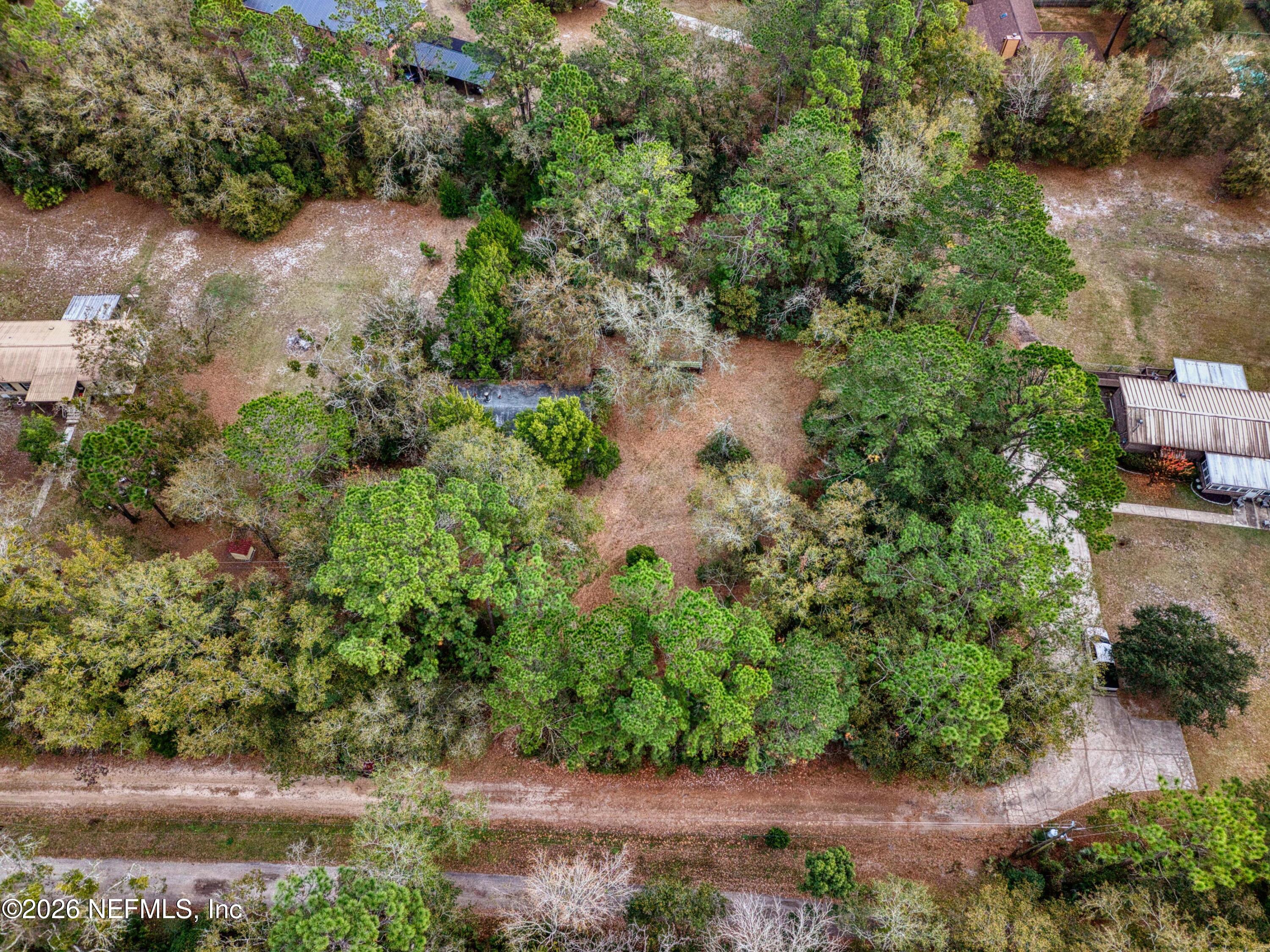1049 Hammond Boulevard Jacksonville, FL 32221 - Photo 16 of 16 an aerial view of residential house with outdoor space and trees all around