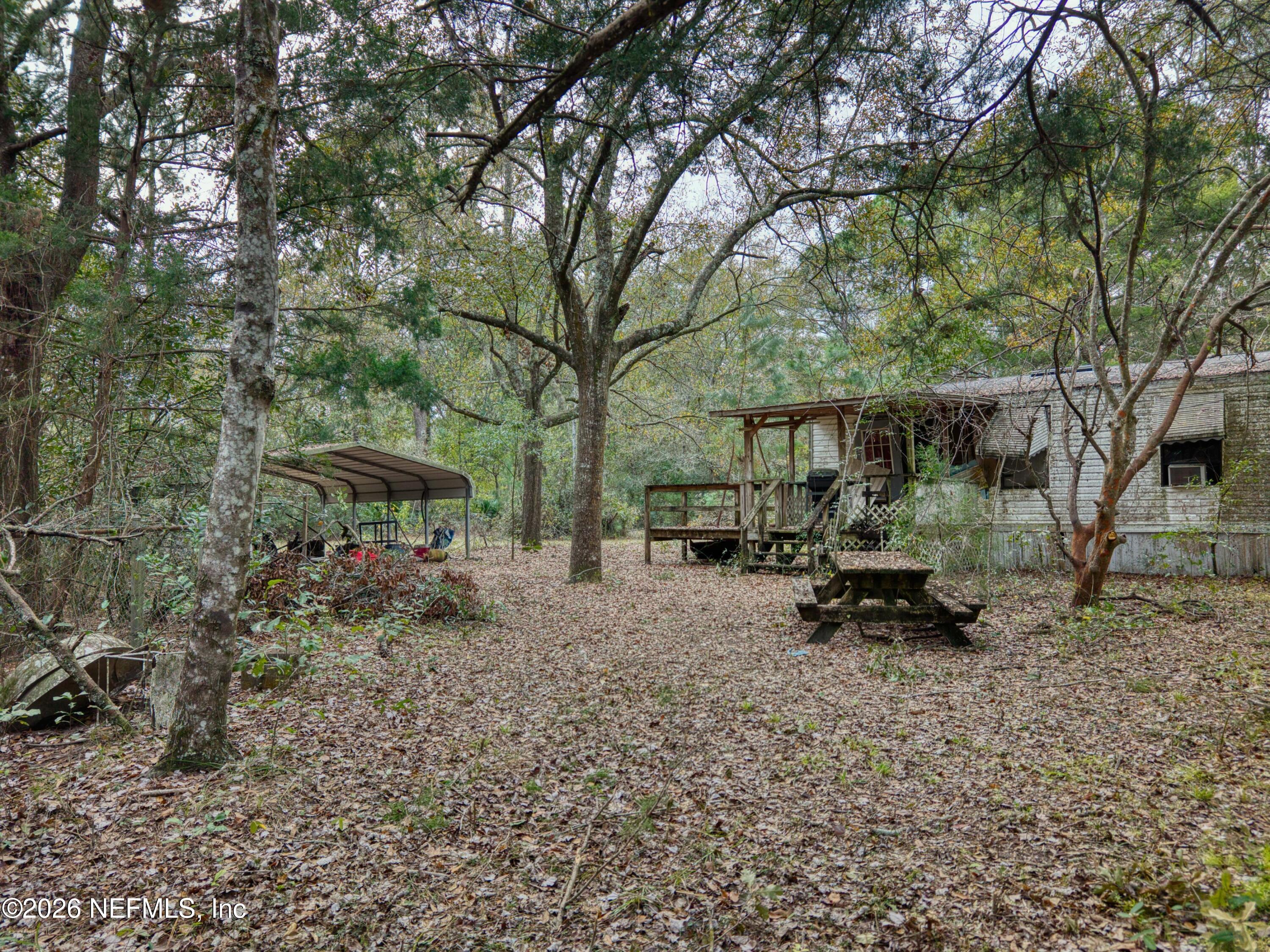 1049 Hammond Boulevard Jacksonville, FL 32221 - Photo 10 of 16 a view of a house with backyard and sitting area