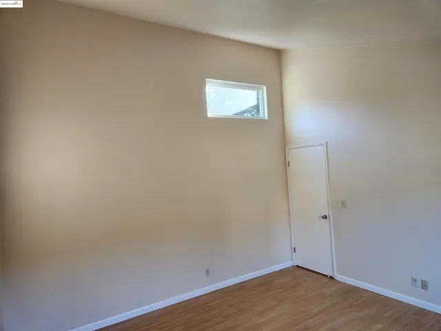 a view of an empty room with a fireplace
