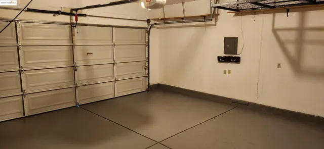 a row of palm trees in front of house