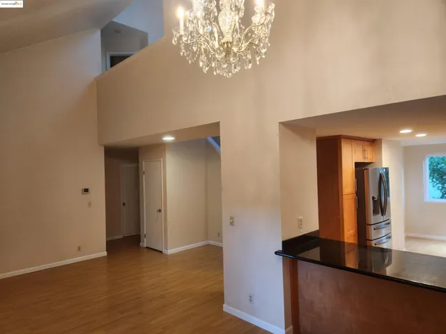 a view of kitchen with cabinets and wooden floor