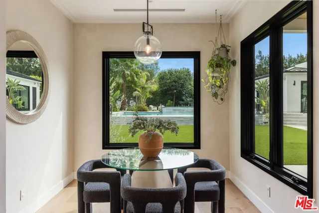 a view of a dining room with furniture window and outside view