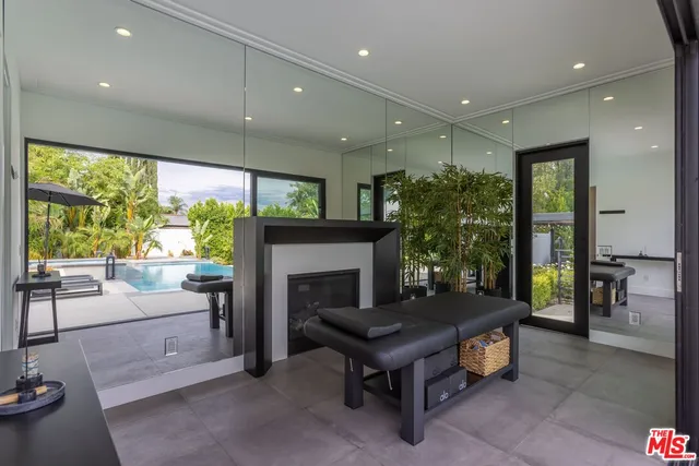 a house view with a sitting space and garden