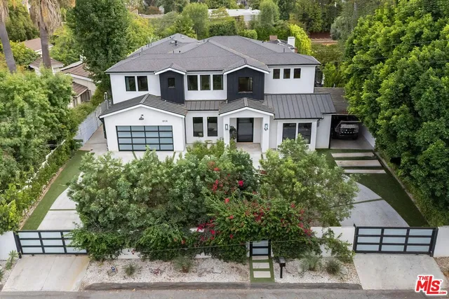 an aerial view of a house with a garden