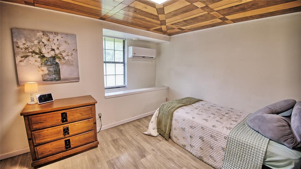 140 Elm Road Nocona, TX 76255 - Photo 15 of 26 a bedroom with a bed and a window